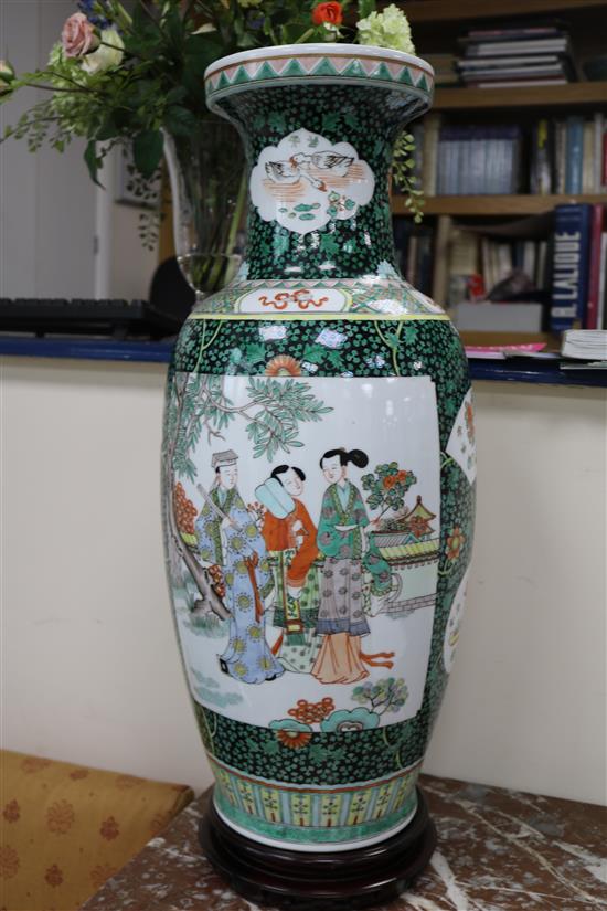 A pair of large Chinese porcelain vases with hardwood stands